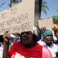 South African women take to the streets to protest xenophobia and deportations.
