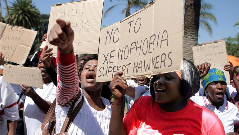 South African women take to the streets to protest xenophobia and deportations.