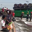 Residents scoop spilled cooking oil from roadside after tanker crash at Ojota, LASTMA warns of health risks