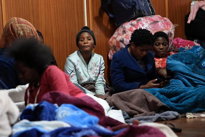 Migrants displaced by recent anti-immigrant violence gather at a temporary shelter in South Africa