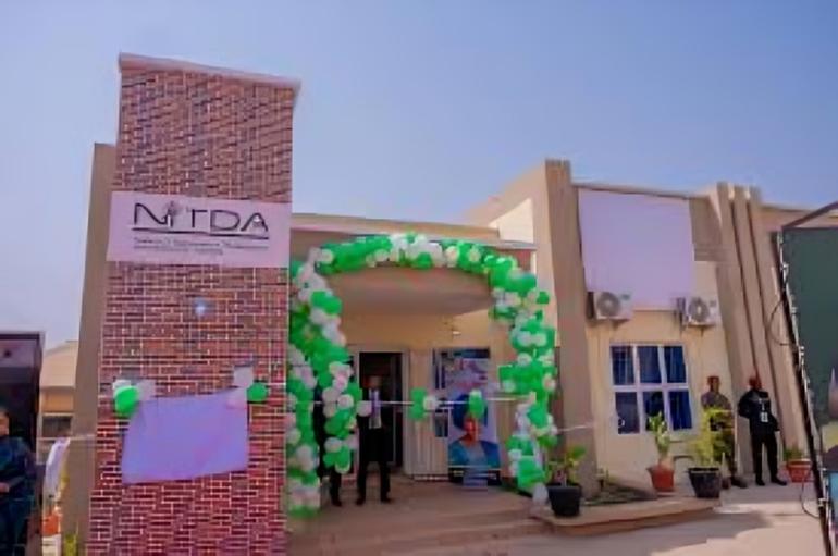 The exterior view of the NITDA-partnered digital research and literacy community centre decorated with green and white balloons.