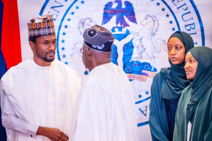 The late former President Muhammadu Buhari's only surviving son, Yusuf and President Bola Tinubu at a special FEC meeting.