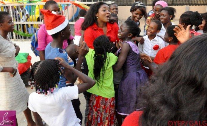 Omotola during the "20 Widows Makeover" programme