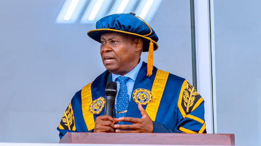 Dr. Adedeji Adeleke, founder of Adeleke University, delivering a speech in academic regalia.