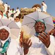 Nigerian Muslim pilgrims praying on Mount Arafat during Hajj pilgrimage in Saudi Arabia.