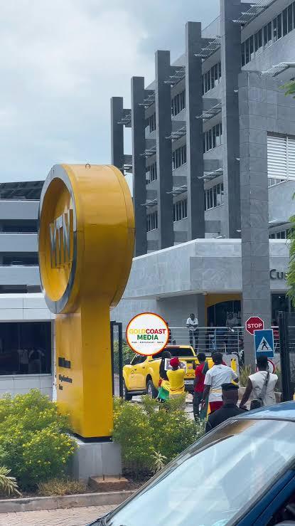 Protesters gather outside an MTN office in Ghana during demonstrations