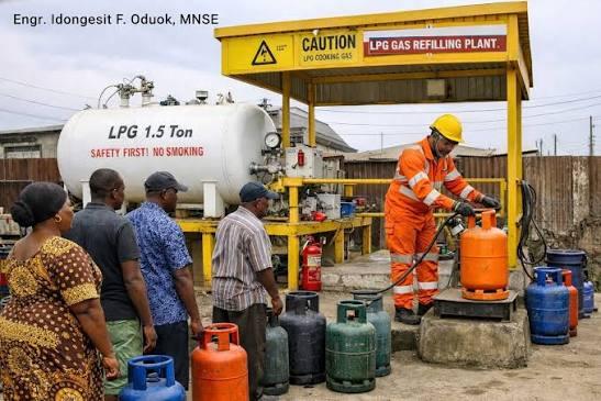 A worker refills a customer's cooking gas cylinder as retailers say many households now buy smaller quantities because of rising prices.