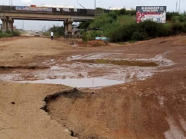 Deep mud and large potholes make this section of the road extremely difficult for commuters and vehicles to pass safely.