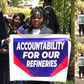Protesters storm UAE Embassy - demand deportation of ex-NNPC chief Mele Kyari