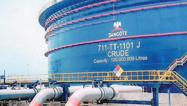 Large blue industrial oil tank at the Dangote Refinery labeled 711-TT-1101 J Crude with a 120,000,000 liters capacity.