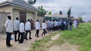 The rescued youths being escorted to transport vehicles following the early-morning raid on the fake tertiary institution in Badagry.