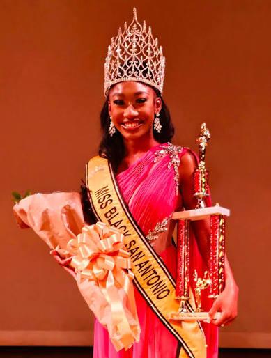 Victoria Oluwakotanmi holding a trophy and wearing her sash and crown after winning the Miss Black San Antonio pageant in 2020.
