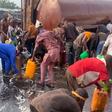 VIDEO: Lagos residents risk fire disaster as they scoop diesel from fallen tanker in Apapa