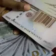 Naira gains N28.85 against dollar at official market