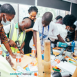 Nigerian youth getting practical vocational skills and engineering training using power tools during a BeMINT workshop.
