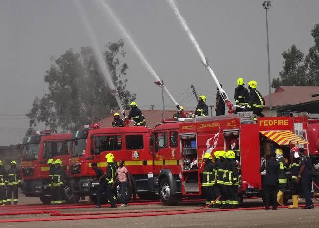 Federal Fire Service trucks spraying water during an emergency drill in Nigeria.