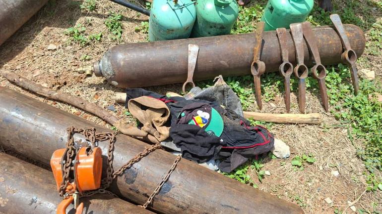 Gas cylinders, pickaxes, and excavation tools recovered by the Nigeria Police from the Adamawa pipeline vandalism syndicate.