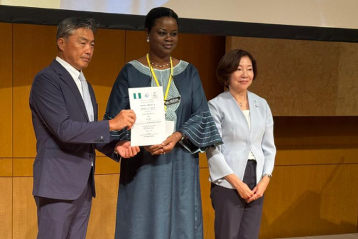 Mrs Florence Akinyemi Adeseke, Nigeria’s charge d’affaires and Yoshikuni Watanabe, the Mayor of Kisarazu with the certificate that designates Kisarazu Nigeria’s hometown. Credit: State House