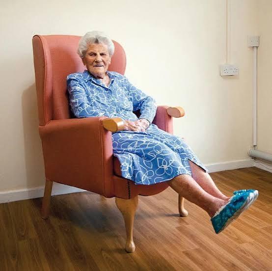 Supercentenarian Ethel Caterham sits comfortably in her chair at age 115.