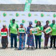Glo’s Commercial Coordinator, Yomi Ogunbamowo (3rd left), Head, CSR, Jumobi Mofe-Damijo (5th right) CSR Manager, Ufuoma Dogun (3rd right) and some of the beneficiaries of the Food Drive initiative held by Glo Foundation, the CSR arm of Globacom.