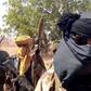 WATCH: Nigerians react as viral video shows alleged armed bandits moving past police officers