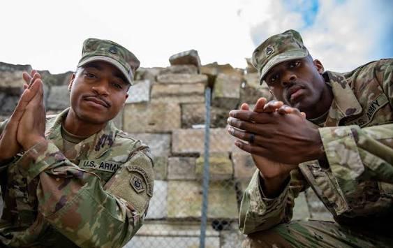 Members of the U.S. Army posing in uniform during a field service detail.