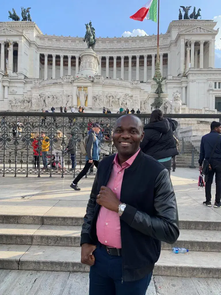 Late Abuja billionaire Chief Godwin Chinedu Lucky Adimike smiling during a vacation in Europe, prior to his tragic death in Guzape.