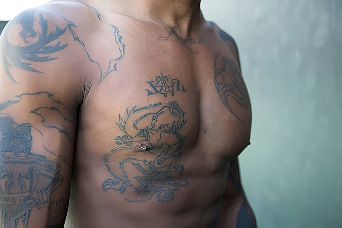 A Nigerian man with tattoo