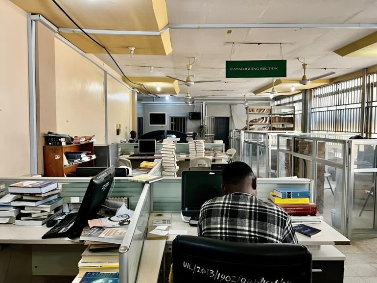 Non-teaching university staff working at computers in the cataloguing section of a Nigerian federal university library