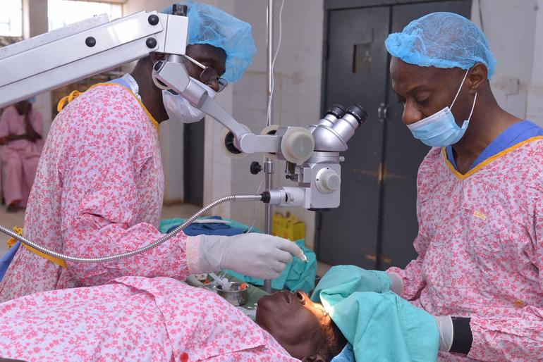Ophthalmologists performing cataract surgery. Cataract is one of the major causes of avoidable blindness.