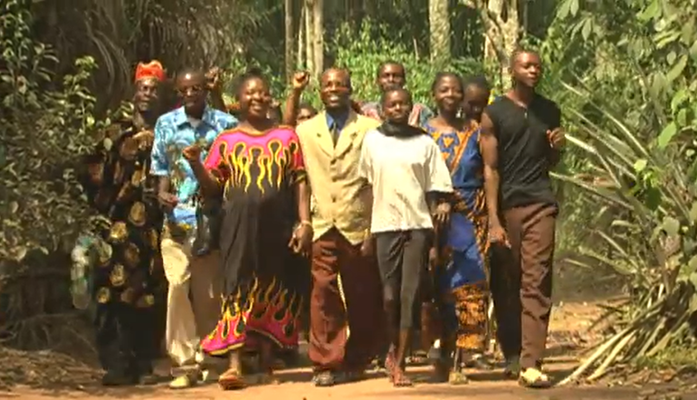 Ekechukwu and his wife, Nneka evangelising with a small gathering of followers in a remote village.