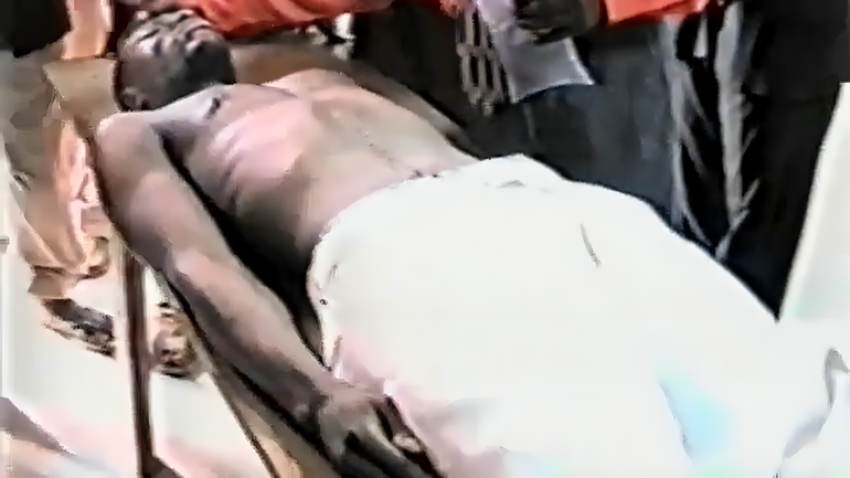 Daniel Ekechukwu's body lying on a table.