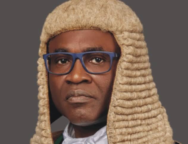 Justice Ayokunle Olayinka Faji of the Federal High Court of Nigeria wearing a formal judicial wig and blue glasses.