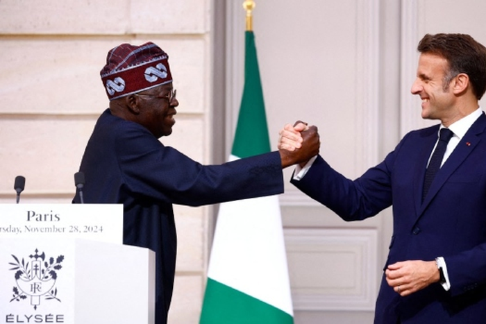 Nigerians react as French President Macron blows pidgin to welcome Tinubu