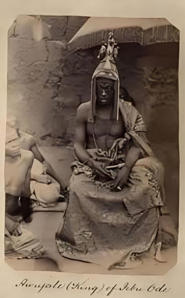 Historical archival photo of Awujale Oba Adesumbo Tunwase the King of Ijebu Ode seated in royal attire with traditional Yoruba crown