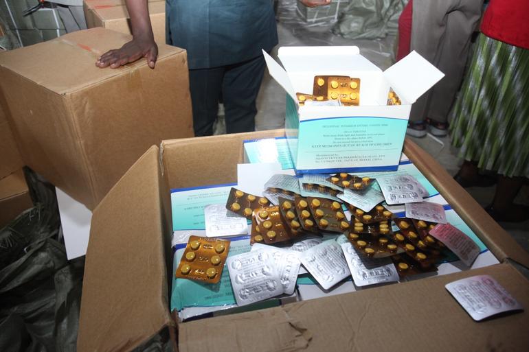 Cardboard boxes filled with confiscated blister packs of counterfeit medicines seized by NAFDAC during a regulatory raid.
