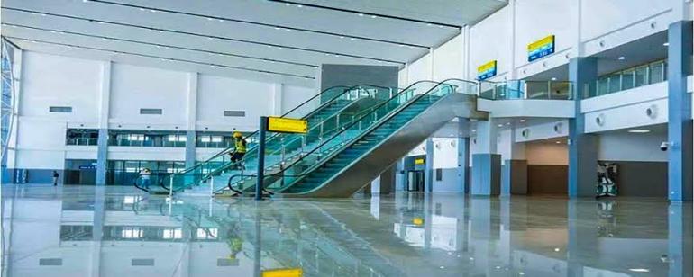 Inside the newly remodelled domestic terminal at MAKIA, featuring modern escalators and upgraded passenger facilities.