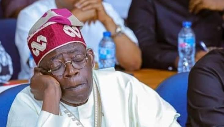 President Bola Ahmed Tinubu resting his head with closed eyes during a public event, referencing Babachir Lawal's comments on the president's health and governance.