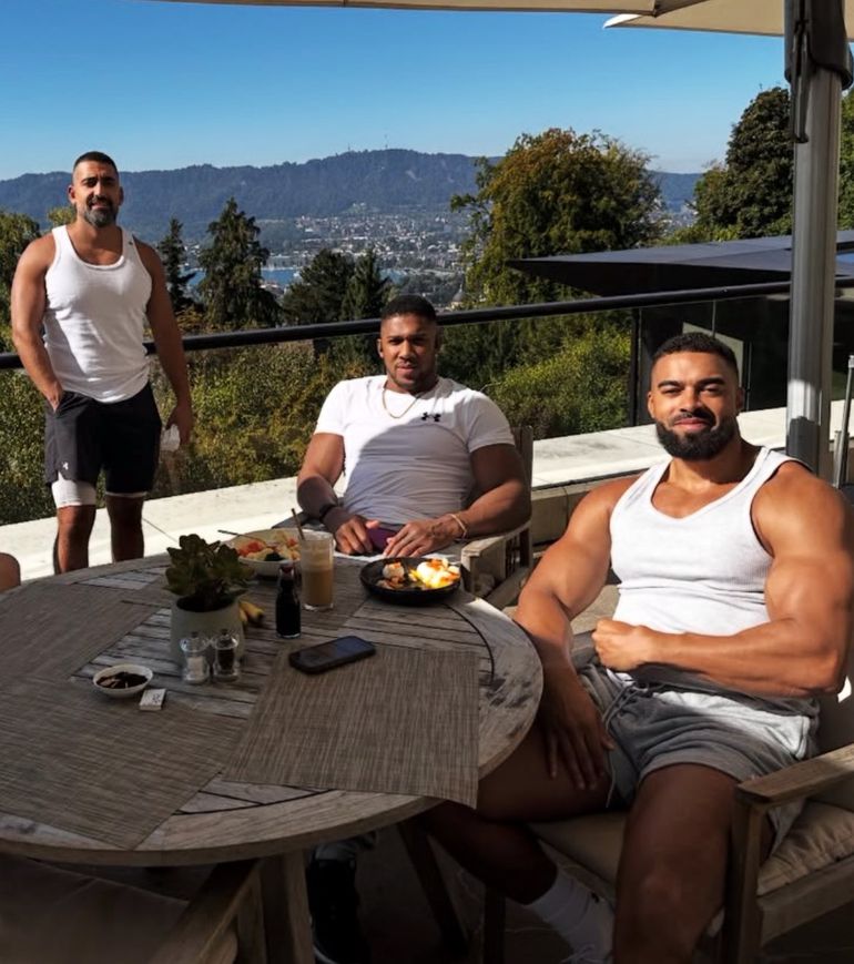 Anthony Joshua with his trainers Lats and Sina Evolve, the two feared dead in the crash