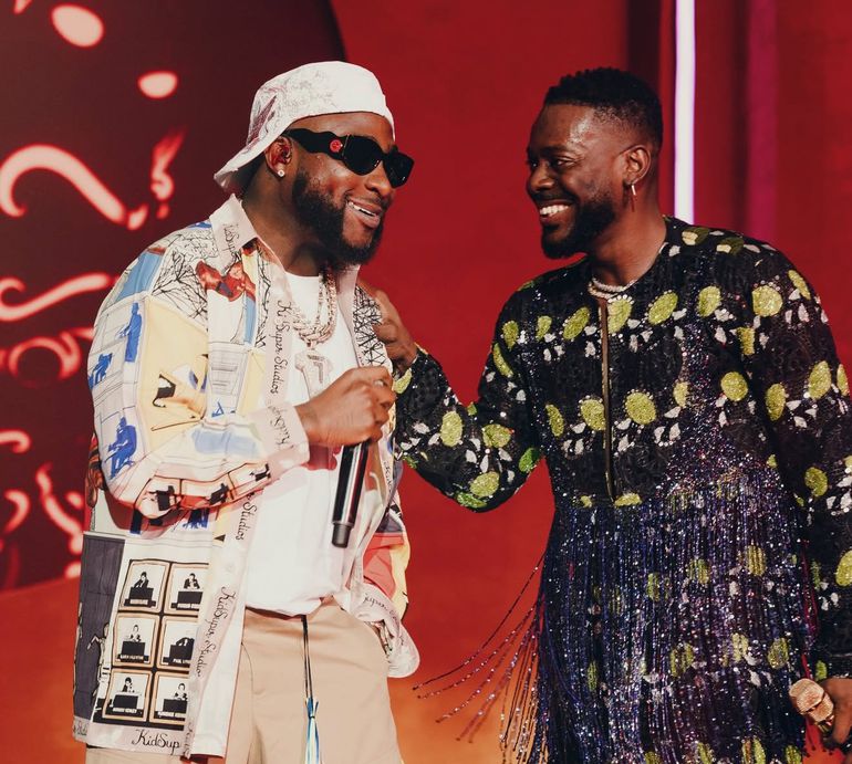 Adekunle Gold and Davido performing at his National Theatre concert