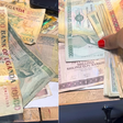 Ugandan woman opens late grandfather’s inheritance to find stash of old demonetised banknotes