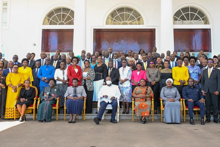 President Yoweri Museveni poses with the outgoing cabinet