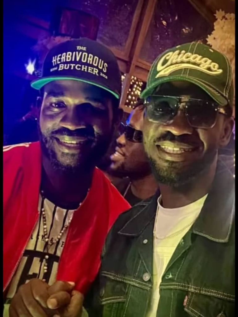 Businge  met Bobi Wine during a music concert in Kampala
