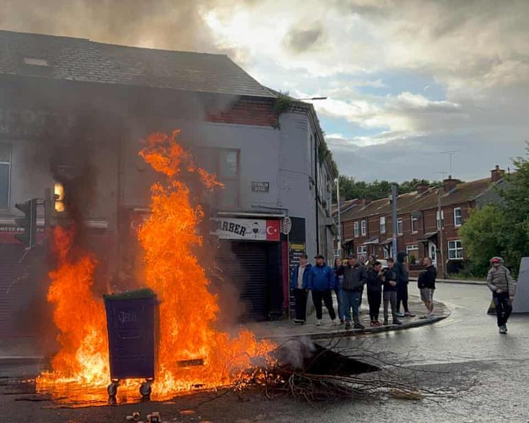 Wheelie bins blaze on the Crumlin Road area of Belfast on Tuesday. Photograph: Claudia Savage/PA