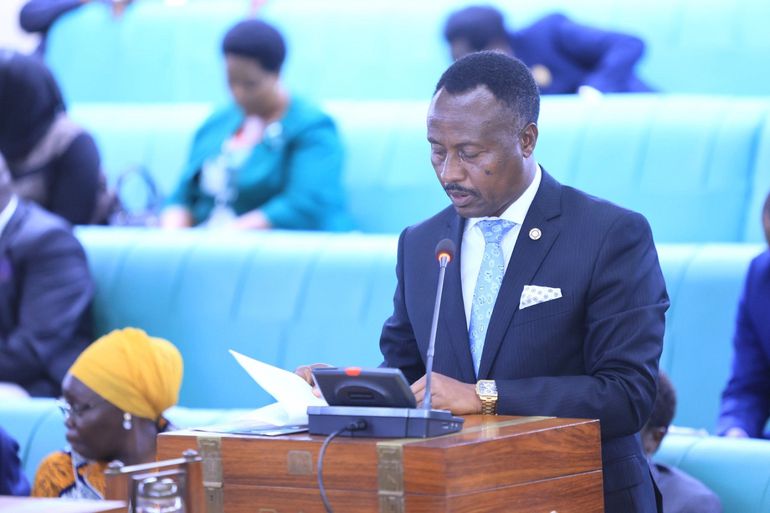 Amos Kankunda presenting the finance committee report