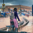 Ugandan online rally to support girl filmed riding bicycle to school in heavy downpour