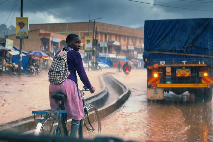Ugandans online rally to support girl filmed riding bicycle to school in heavy downpour
