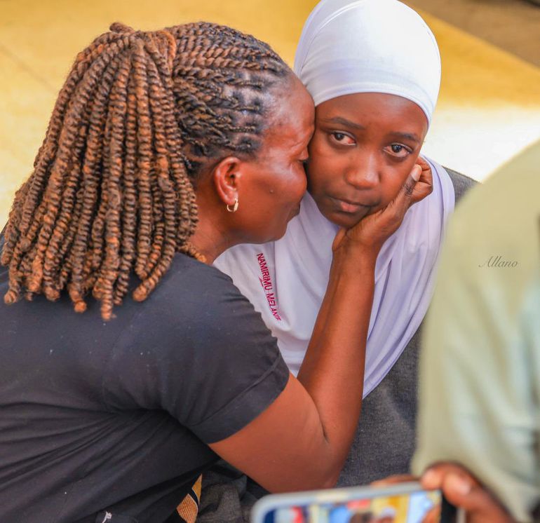 Hellen Nakimuli's daughter cries as her mother's remains are released from Mulago City Mortuary