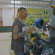 Fik Fameica receives electric motorcycle as Spiro unveils him as East Africa ambassador