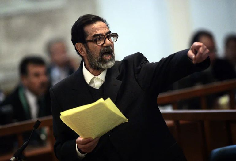 Former Iraqi President Saddam Hussein argues with prosecutors while testifying during cross-examination at his trial in Baghdad's Green Zone, April 5, 2006.